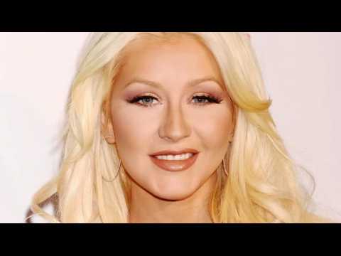 VIDEO : Christina Aguilera Almost Fell Into a Tree After Christmas Party