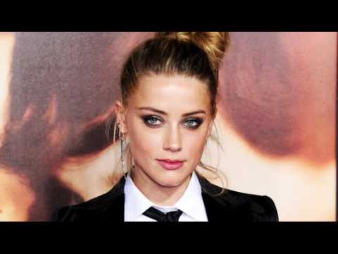 VIDEO : Amber Heard Pleads Not Guilty to Illegal Dog Importation in Australia