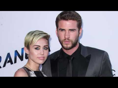 VIDEO : Miley Cyrus Waits On Liam Hemsworth Hand and Foot!