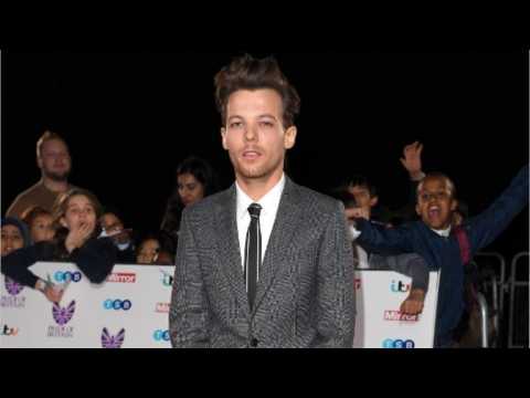 VIDEO : Louis Tomlinson Arrested After Brawl with Paparazzi