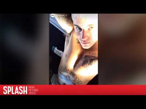 VIDEO : Justin Bieber Gets Giant Bear and Eagle Tattoos
