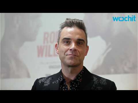 VIDEO : Robbie Williams Sees a Take That Reunion 'At Some Point'