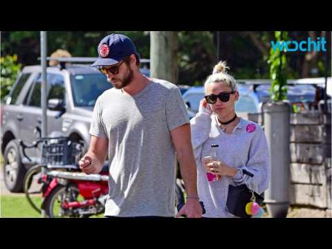 VIDEO : Miley Cyrus And Liam Hemsworth Sport Their Brightest Colors