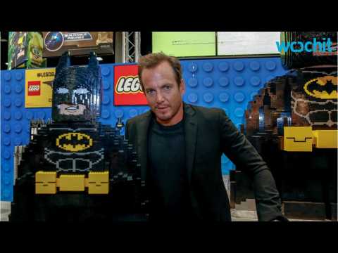VIDEO : Will Arnett Walks Down 12ft Bed Of Legos