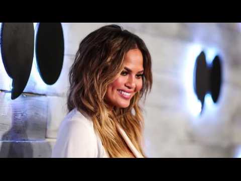 VIDEO : Chrissy Teigen Wows In White After Admitting Fertility Problems