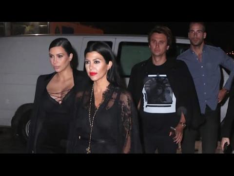 VIDEO : Kim Kardashian Struggles To Contain Her Cleavage During Fashion Week