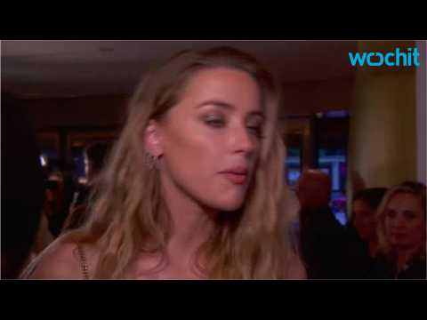 VIDEO : Amber Heard Cozying Up with... Elon Musk?