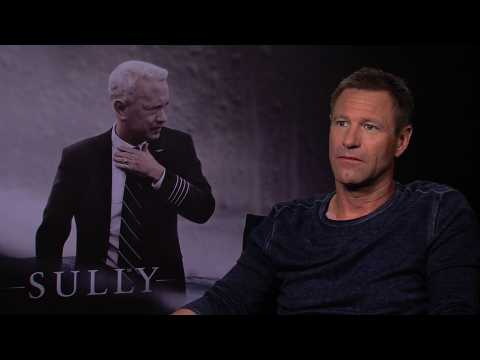 VIDEO : Exclusive Interview: Aaron Eckhart explains the darker side of being a hero