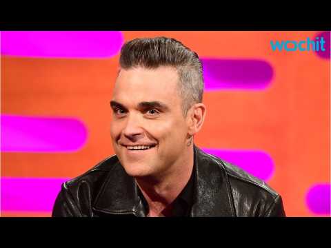 VIDEO : Robbie Williams New Song Pokes Fun At Russians