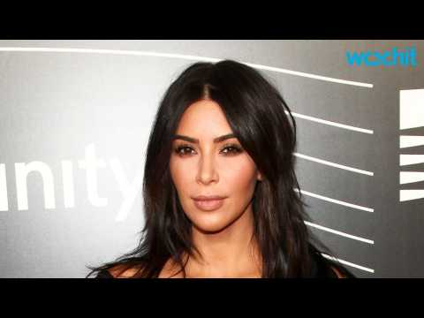 VIDEO : Kim Kardashian Debuts New Lip Ring at Christmas Party