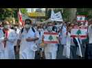 Lebanese march towards Beirut port one year after explosion