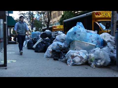 Trash piles up in New York as sanitation workers protest vaccine mandate