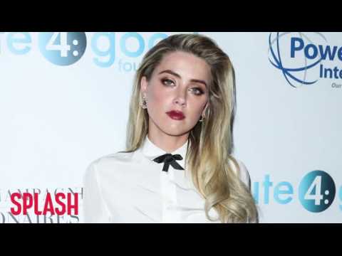 VIDEO : Amber Heard is Back in Australia, This Time Without Her Dogs