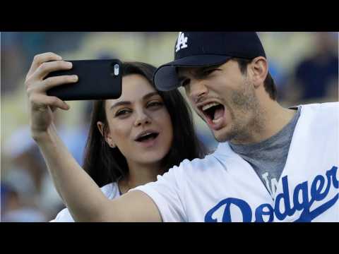 VIDEO : Ashton Kutcher & Mila Kunis Cuddle At Dodgers Game