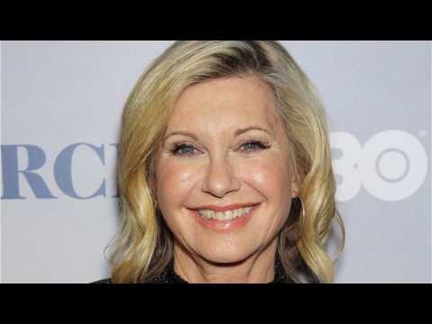 VIDEO : Olivia Newton-John Pokes Fun At 'Exaggerated' Rumors About Her Health