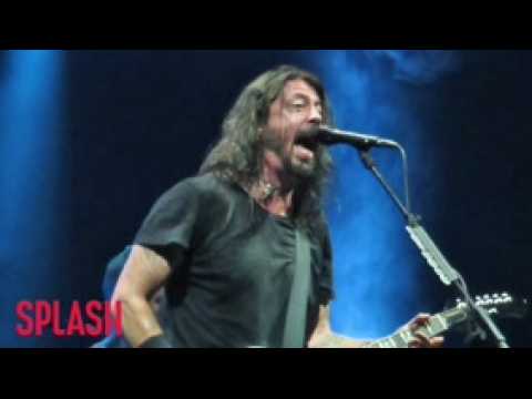 VIDEO : Dave Grohl Takes A Tumble After Downing Bud Light Beer