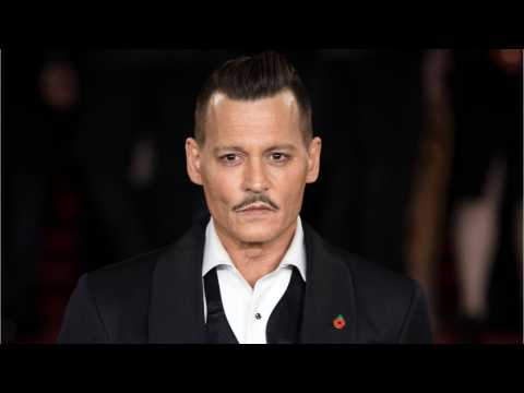 VIDEO : Johnny Depp Is Being Sued For Allegedly Punching A Man On A Film Set