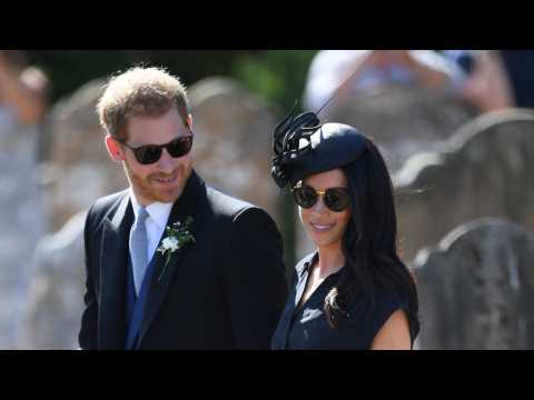 VIDEO : Meghan Markle's Bra Peeks Through In Black Dress At Royal Wedding
