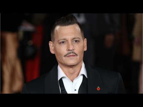 VIDEO : Johnny Depp Settles Lawsuit Against Managers
