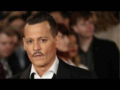 VIDEO : Johnny Depp Settles Lawsuit Against The Management Group
