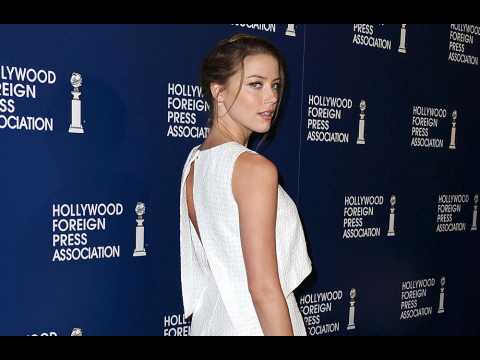 VIDEO : Amber Heard donates divorce settlement to charity