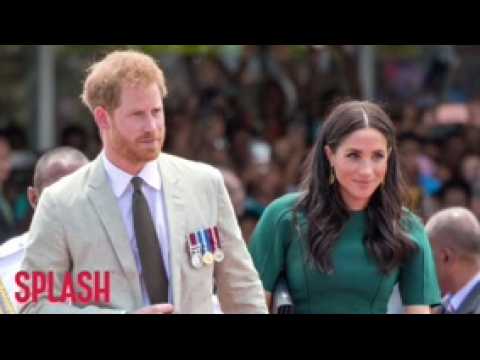 VIDEO : Duchess Meghan stuns in a green dress as she pays tribute to fallen soldier