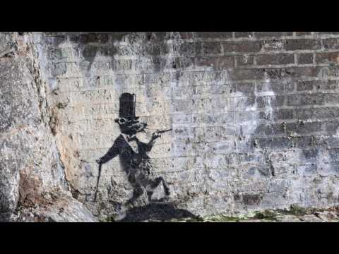 VIDEO : Banksy Painting Self-Destructs After Being Sold For 1.4 Million Dollars At Auction