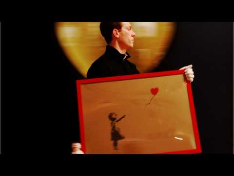 VIDEO : Banksy's Balloon Girl Painting Self-Destructs After Being Sold For Over 1 Million Pounds