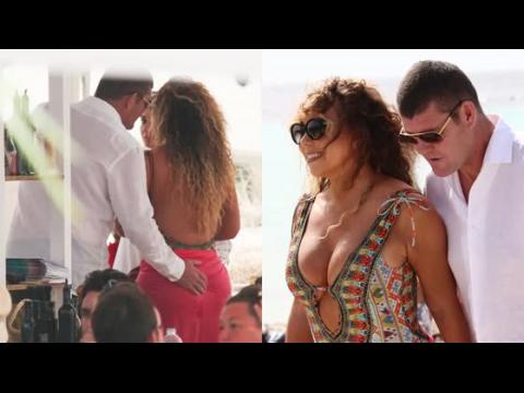VIDEO : Mariah Carey Gets A Cheeky Squeeze As She Steps Off Super Yacht