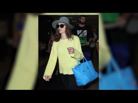 VIDEO : Emmy Rossum Lands And Heads Straight To Starbucks
