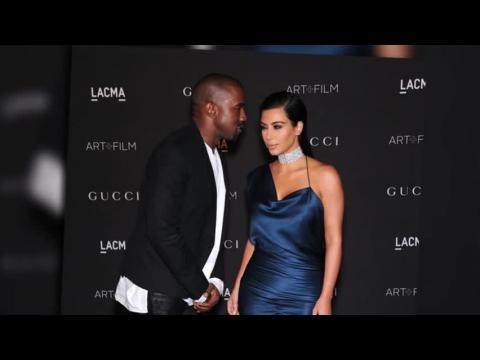 VIDEO : Is Kim Kardashian Trying to Reveal That She is Pregnant?