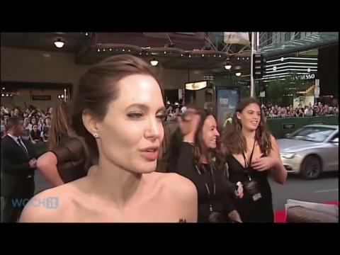 VIDEO : Angelina jolie and brad pitt walk their first red carpet as a married couple at unbroken wor