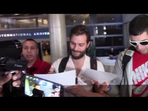 VIDEO : Jamie Dornan Gets Mobbed at Los Angeles Airport, Gets Asked About His 'Grapes'