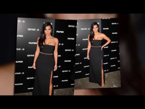 VIDEO : Kim Kardashian Covers Up For The Paper Break The Internet Party