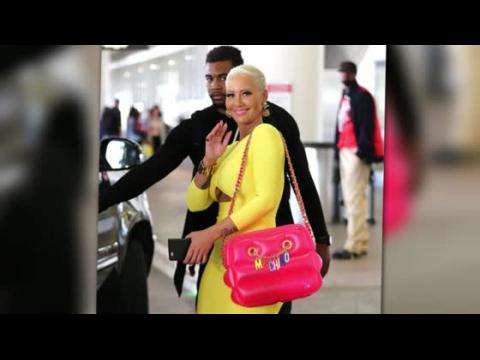 VIDEO : Amber Rose In Candy Colours With Inflatable Moschino Bag