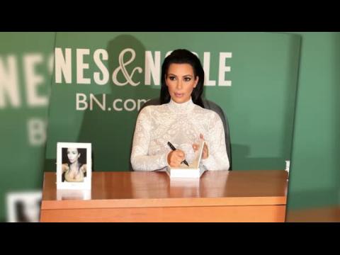 VIDEO : Kim Kardashian Promotes 'Selfish' In Sheer Lace Top