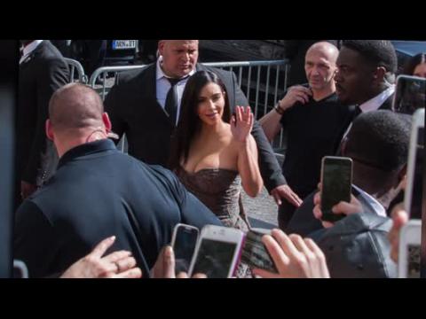VIDEO : Kim Kardashian Showcases Her Cleavage For Kardashian Hair Paris Launch