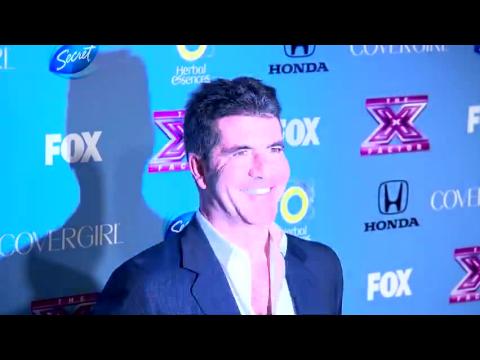VIDEO : Simon Cowell Isn't a Hand-On Dad
