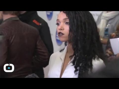 VIDEO : Robert pattinson gets cosy with fka twigs at brit awards 2015