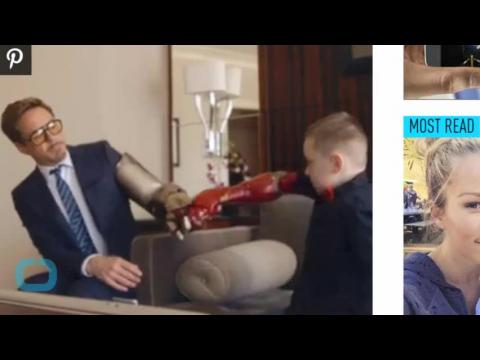 VIDEO : Robert downey jr. presents iron man bionic arm to 7-year-old boy