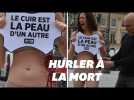 Pendant la Fashion Week, une militante de Peta fait mine de s'arracher la peau