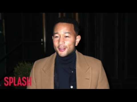 VIDEO : John Legend Is Being Taught To Swim By An Olympic Athlete!