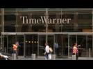 Time Warner, Disney shares sink