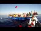 Italian coastguard rescues migrants stranded off the Libyan coast