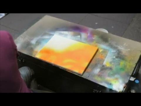 Edinburgh street artist creates spray-paint space painting using household items