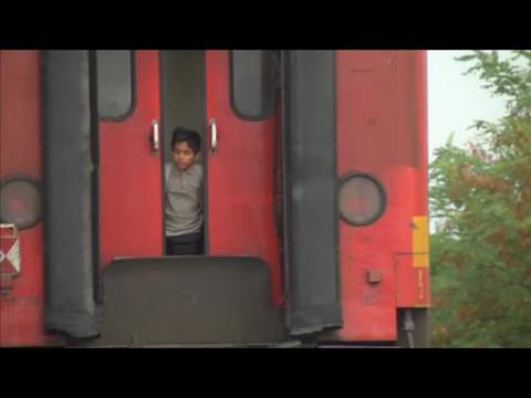 Migrants board train  in Macedonia