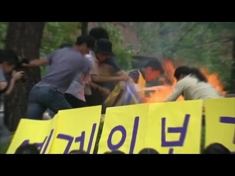 A man sets himself on fire at a rally for former comfort women in South Korea.