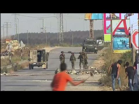 Palestinians clash with Israeli troops after funeral of slain youth