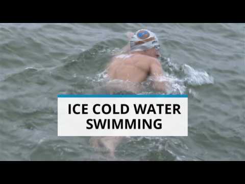 Dare to dive in ice cold water? This swimmer does