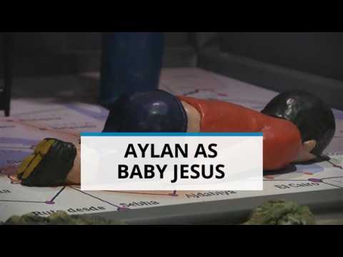 Odd nativity scene: Dead Syrian toddler as Baby Jesus